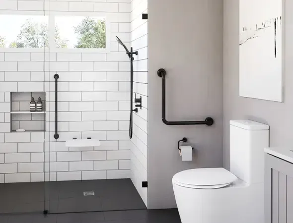 Accessible Cincinnati bathroom renovation with a curbless shower, fold-down seat, handheld showerhead, and strategically placed grab bars