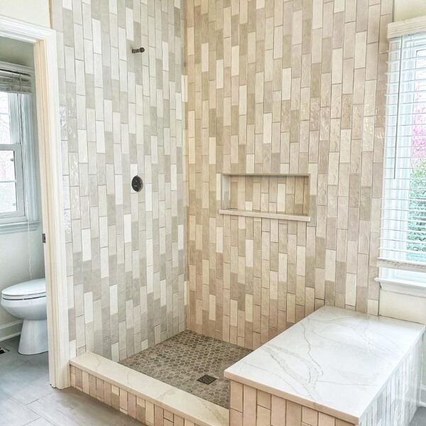 Bathroom remodel in Cincinnati featuring a shower being remodeled with vertical offset tile.