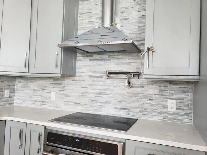 Tile installation in Cincinnati featuring a tiled kitchen backsplash.