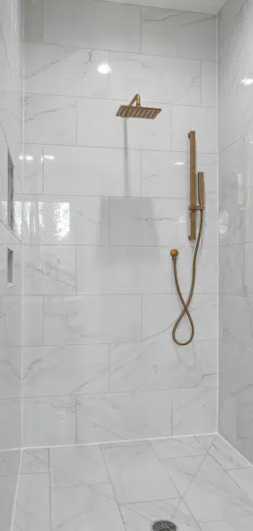 Cincinnati Bathroom Remodel team members with after completing a walk-in shower remodel.